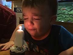 Oh Dear. Two-Year-Old Birthday Boy Just Can't Blow Out Candle on Cake