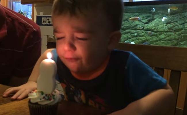 Oh Dear. Two-Year-Old Birthday Boy Just Can't Blow Out Candle on Cake