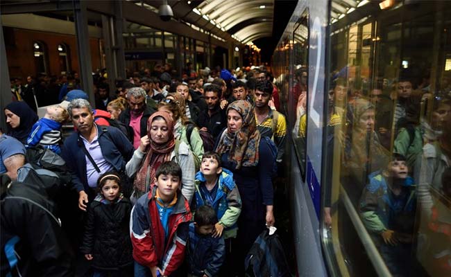 Germany Welcomes Thousands of Weary Migrants
