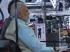 PM Modi Takes Ride in Electric Car Factory With Tesla Chief