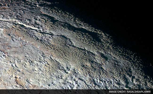 Pluto Reveals Variety of Rich Colors, Stunning Experts