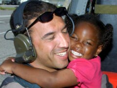 Rescuer to Meet Kid From Hurricane Katrina Hug Photo