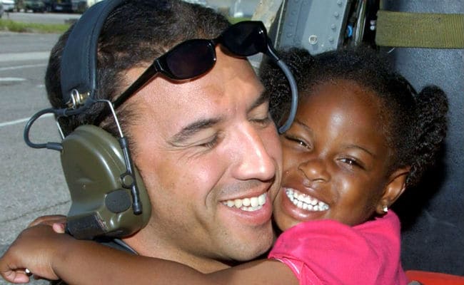 Rescuer to Meet Kid From Hurricane Katrina Hug Photo