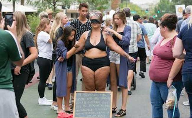 She Undresses on a Street. Sounds Familiar? There's One Big Difference