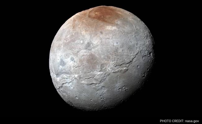 Pluto 'Paints' Its Largest Moon Red: NASA