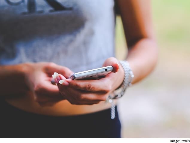 Looking down at a phone for long periods strains the neck and back muscles