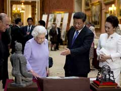 Pomp and Protests as China's Xi Jinping Meets Queen Elizabeth II