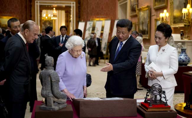 Pomp and Protests as China's Xi Jinping Meets Queen Elizabeth II