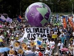 Thousands Join Climate Change Marches Across Asia