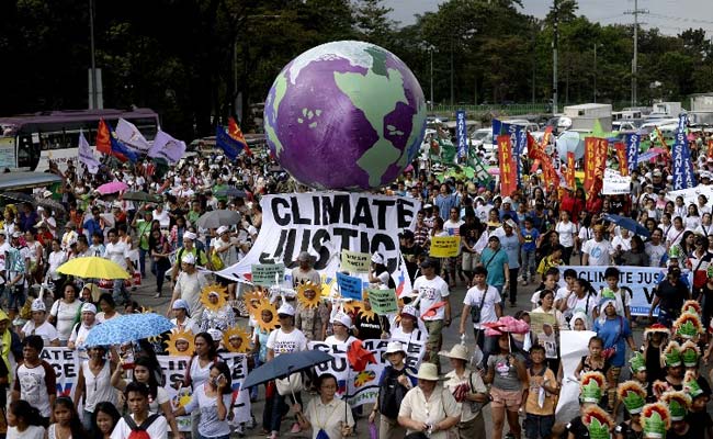 Thousands Join Climate Change Marches Across Asia