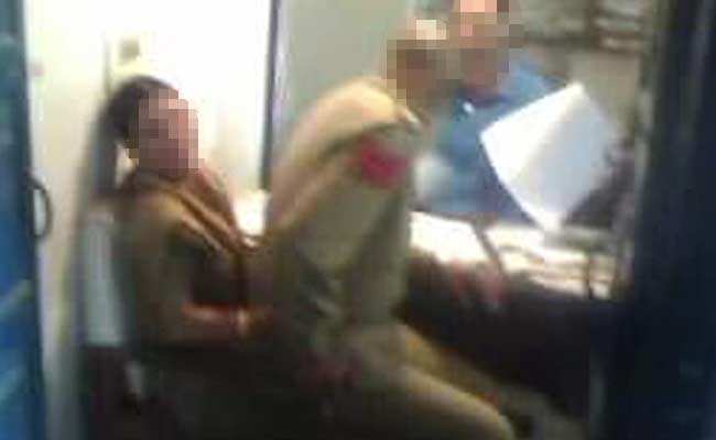 Cop Suspended After Seen in Pictures Sitting on Woman Officer's Lap