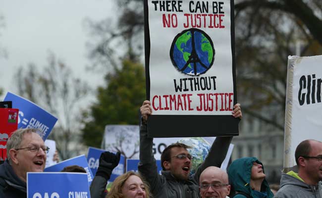 Climate Talks Run Overtime to Reach Deal Amid Differences