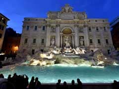 Cheers, Kisses as Rome's Trevi Fountain Reopens