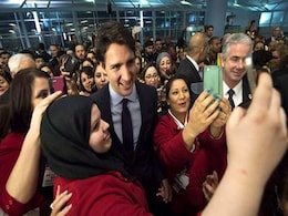 'Welcome Home,' Justin Trudeau Greets Refugees As Plane Arrives In Canada 'Welcome Home,' Justin Trudeau Greets Refugees As Plane Arrives In Canada
