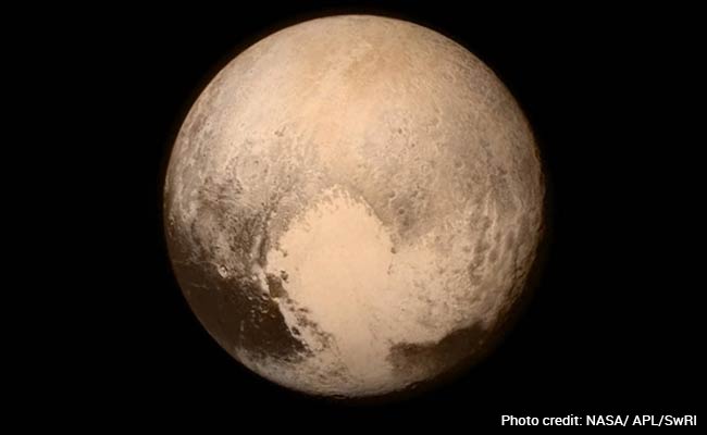 Pluto, Poop and Perils of Gene Editing: This Year's Best Science Stories