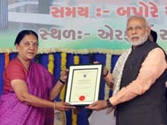 PM Hands Over Shyamji Verma's Reinstatement Certificate To Anandiben Patel