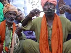 Snake Charmer Puts Live Snake through Nose and Lets it Come Out from Mouth