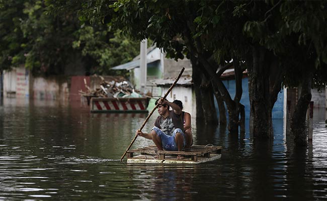 Floods Force Thousands Into Shelters In South America