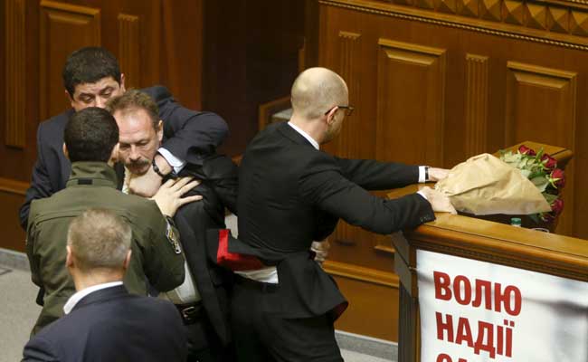 Ukraine Lawmaker Manhandles Prime Minister In Rowdy Parliament Scenes