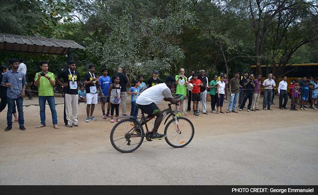 Solving 111 Rubik's Cubes On Bicycle, Physics Student Shoots For Guinness