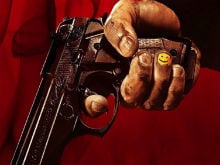 <I>Rocky Handsome</i> 'Smiles' With a Gun in New Poster