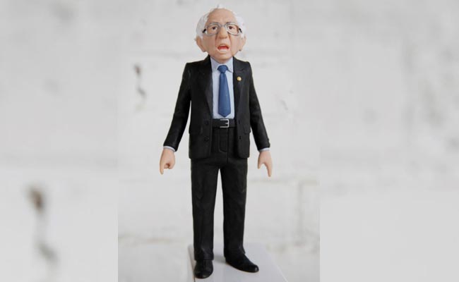 Bernie Sanders Action Toy Slouches, Points And Raises Lots Of Cash