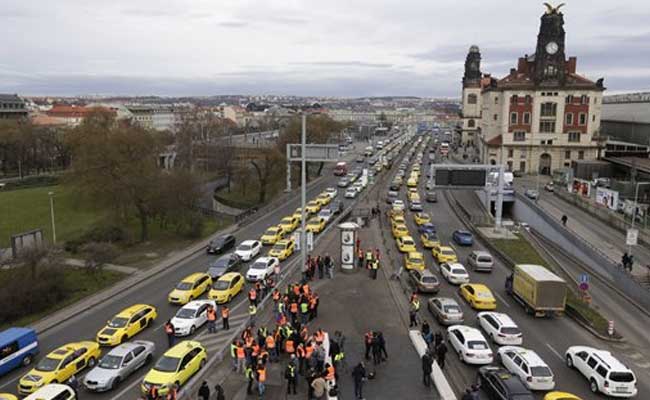 Taxi Drivers In Prague Block Traffic, Demand Higher Pay, Ban On Uber