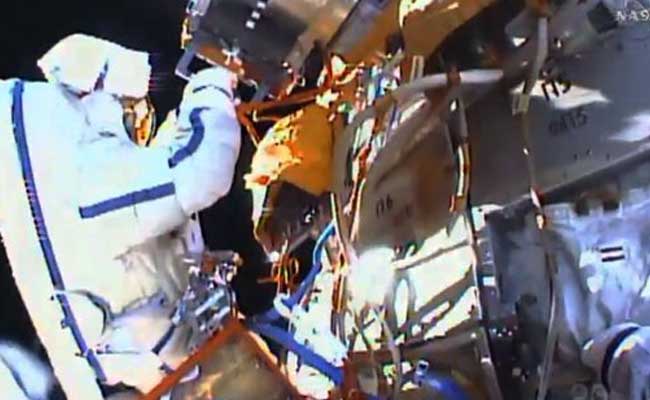 Russians Go Spacewalking To Collect Experiments, Test Glue