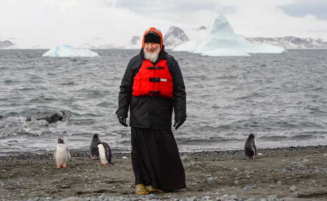 Russian Patriarch Strolls With Penguins On Antarctica Trip