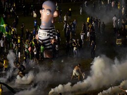 Police Fire Tear Gas At Protests Against Brazil's President Police Fire Tear Gas At Protests Against Brazil's President