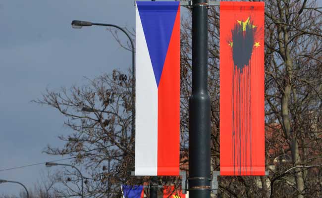 Chinese Flags Defaced In Prague Ahead Of President Xi Jinping's Visit