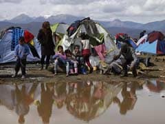 Migrants Stuck In Greek Makeshift Camp Vow To Stay Put