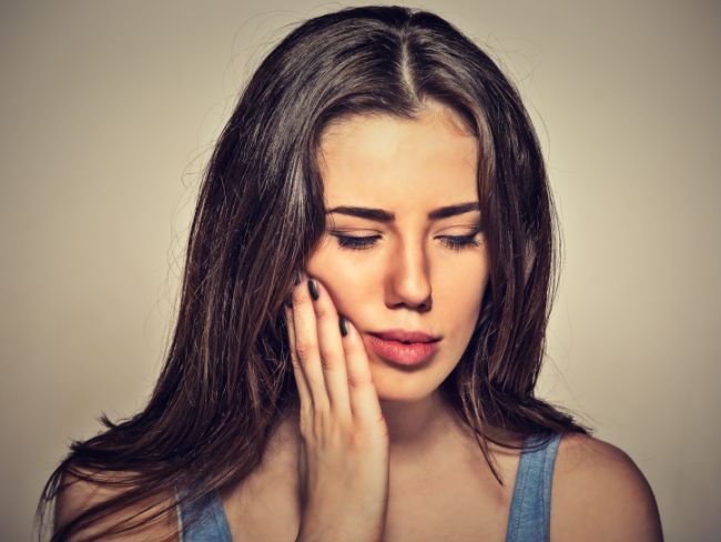 Bruxism can lead to irritated and itchy gums due to the pressure and friction