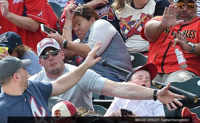 Hero Dad Saves Son From A Flying Baseball Bat In Viral Photo