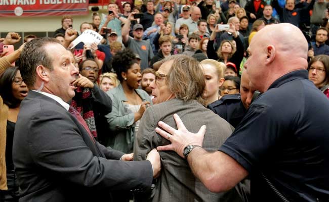 Hecklers Disrupt Donald Trump Rally, Photographer Shoved To The Ground