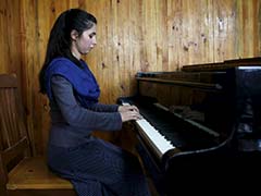 Afghan Teenager Braves Threats, Family Pressure To Lead Women's Orchestra