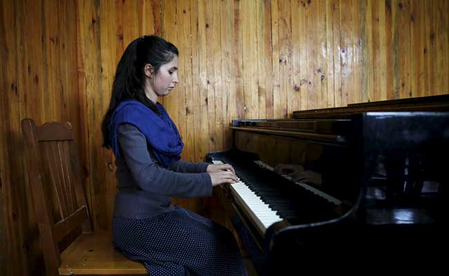 Afghan Teenager Braves Threats, Family Pressure To Lead Women's Orchestra