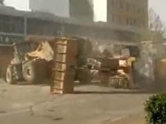 Only in China: 6 Bulldozers Fight it out on the Street in Viral Video