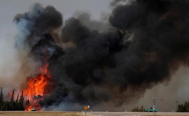 Canada Fire Rages For Seventh Day, Evacuees Brace For Long Wait