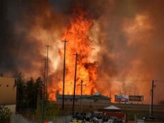 Canadians Drive Through Burning City Seeking Safety