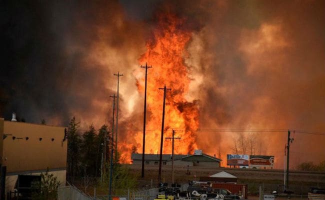 Canadians Drive Through Burning City Seeking Safety
