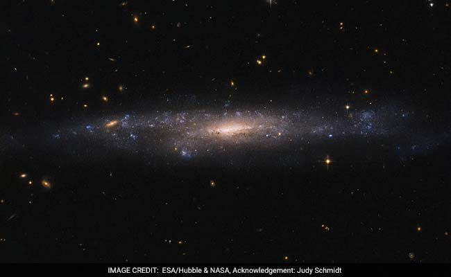 Hubble Space Telescope Spots Rare Hidden Galaxy In Night Sky