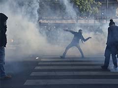 Hooded Protesters Clash With Police In Paris Over Labour Law