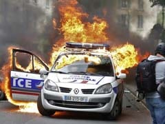 Police Car Surrounded And Set Alight In Central Paris