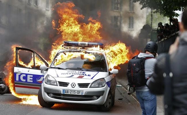 Police Car Surrounded And Set Alight In Central Paris