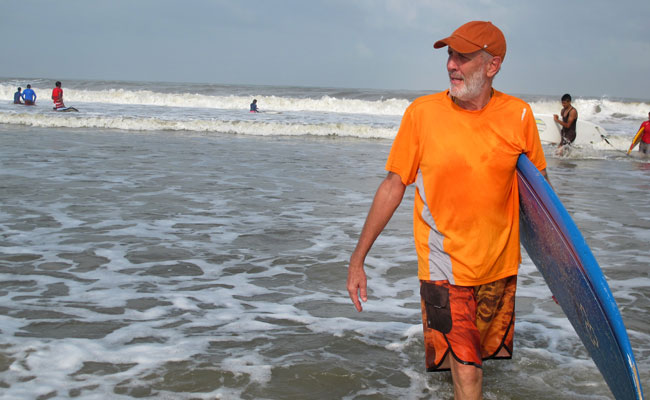 India's 'Surfing Swami' Preaches The Virtues Of The Perfect Wave Repeating
