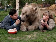 Bear Hug? No Problem. Meet 7-Feet-Tall Stepan And His Humans