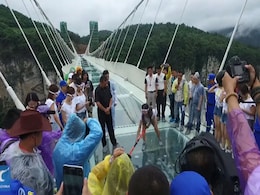 Tourists Test The Safety of 984-Foot High Chinese Glass Bridge - With Sledgehammers Tourists Test The Safety of 984-Foot High Chinese Glass Bridge - With Sledgehammers