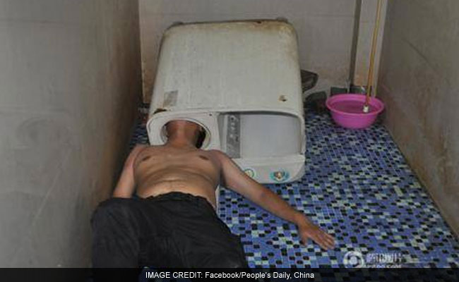 Chinese Man Tries To Fix Washing Machine, Gets His Head Stuck In It