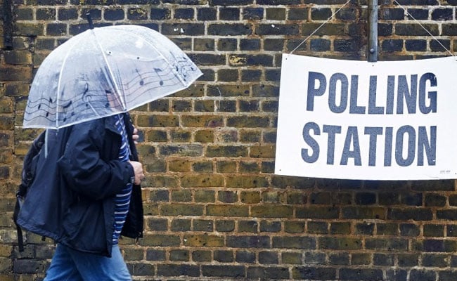 Britons Brave Torrential Rain To Vote In European Union Referendum